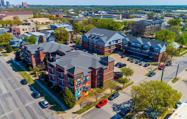 an aerial view of a building with a mural on the side of the building
