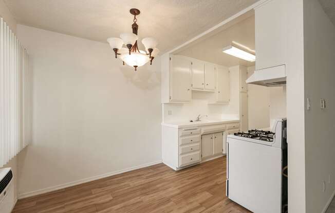 Dining Room with Hardwood Floors and Chandelier