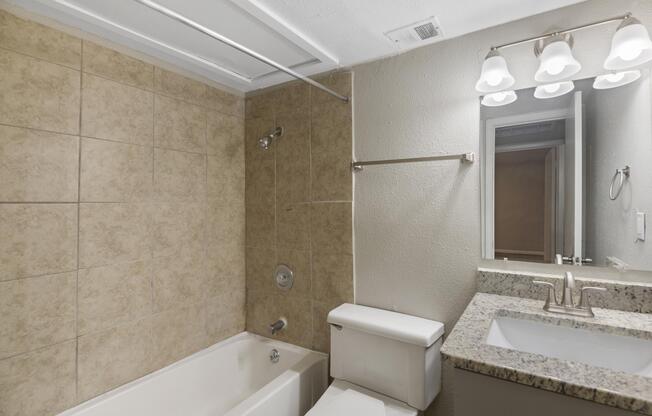 a large tub next to a sink