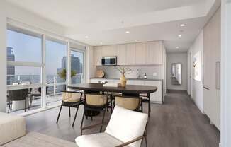 A modern kitchen with a dining table and chairs.