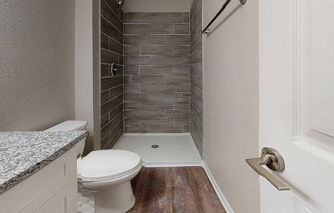 Renovated Bathrooms with Tile Shower Surrounds at Spalding Vue Apartments, Peachtree Corners, Georgia