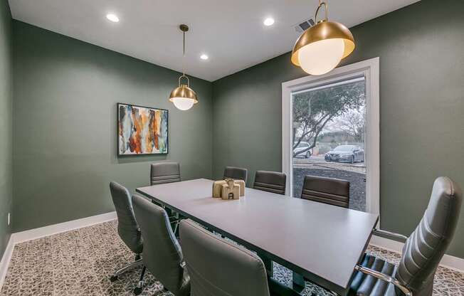 a conference room with a table and chairs and a window