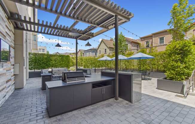 Outdoor Patio with Grill and Seating at Aventine Apartments in Hercules, CA 94547