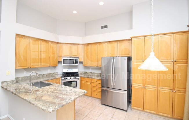 5997 W AURORA DR