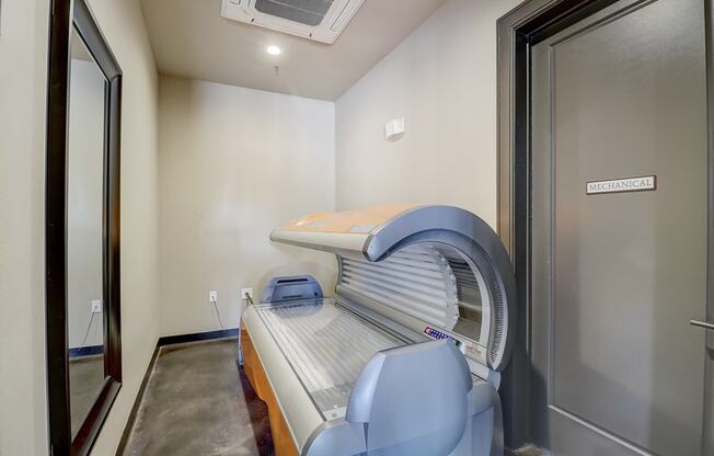 a patient room with an exam bed and an exam room door