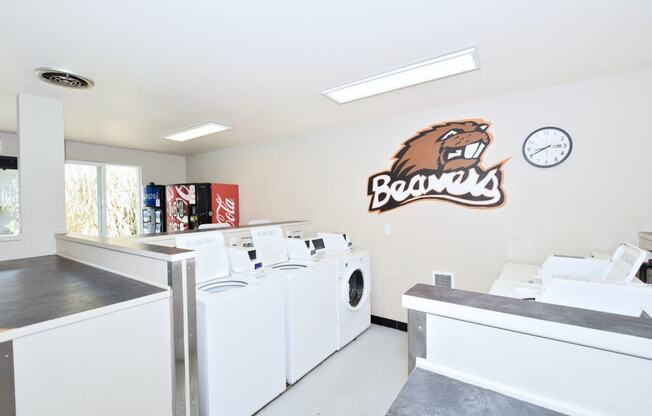 a laundry room with a bears logo on the wall