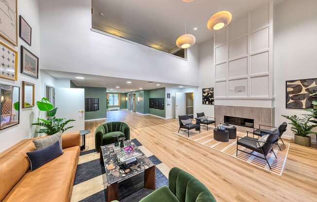 Lobby interior with plenty of seating, high ceilings and a fireplace