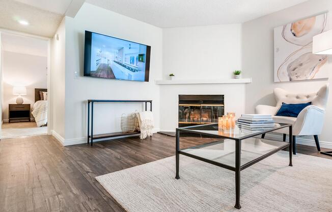 a living room filled with furniture and a fireplace