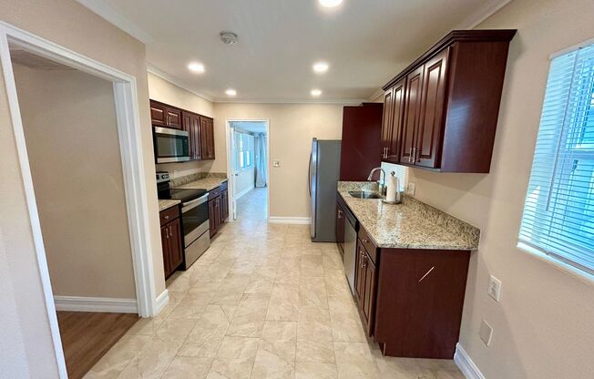 Gorgeous updated 2-bedroom 2-bath home with garage and fenced in backyard