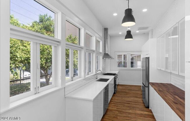Roosevelt Row historic and updated home close to everything downtown! Truly unique!!!  Absolute stunner that is an Oasis in the City!!!  Everything redone!!  True Charmer!!!