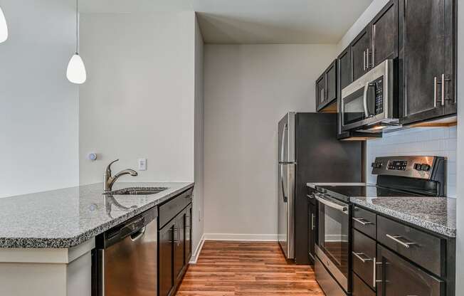 Kitchen with cabinets and white countertops at The View at Old City, Philadelphia