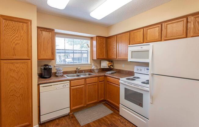 a kitchen with a refrigerator stove and microwave