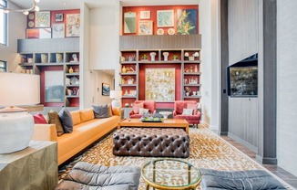 a living room filled with furniture and a book shelf  at Edge and Stone, San Antonio, 78260