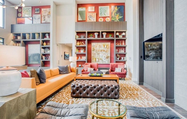 a living room filled with furniture and a book shelf  at Edge and Stone, San Antonio, 78260