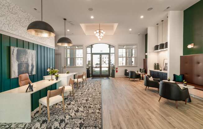 a communal area with chairs and tables and a reception desk
