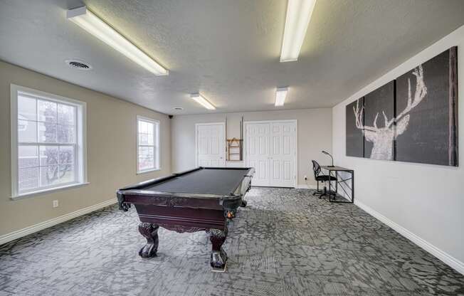 a spacious game room with a pool table