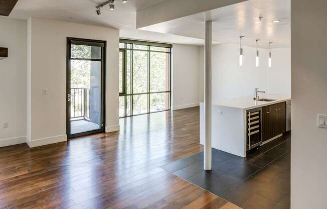A kitchen area with a sink and a window.