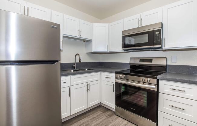 a kitchen with a stove and a refrigerator