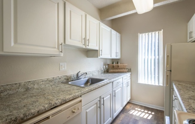 This is a photo of the kitchen in the 965 square foot 2 bedroom, 2 bath  apartment at Harvard Square Apartments, in Dallas, TX.