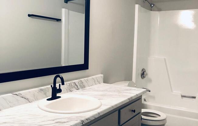 We have white marble style countertops at The Roosevelt Apartment Homes