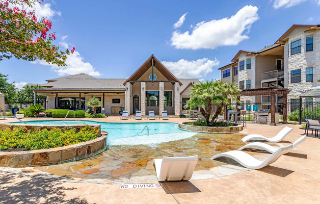 Swimming Pool With Relaxing Sundecks at Park Hudson Place Apartments, Bryan, Texas