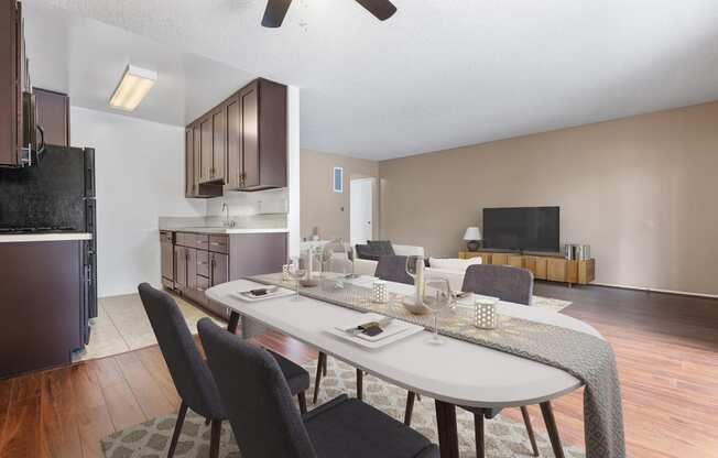 an open living room and dining room with a table and chairs