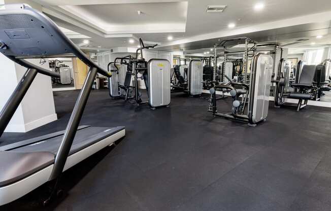 a gym with treadmills and other exercise equipment