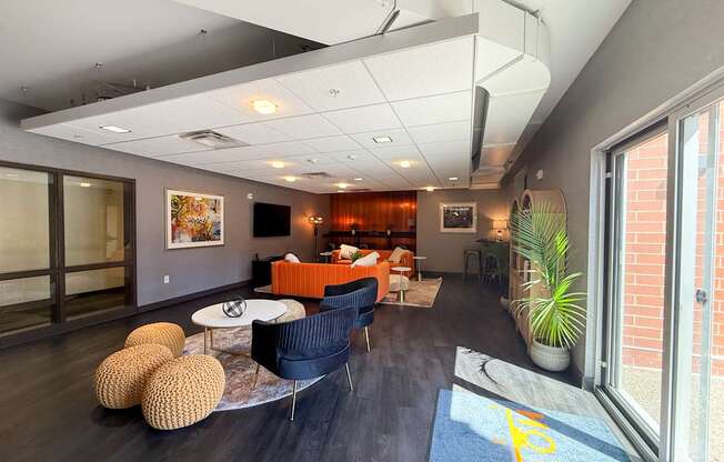 A living room with a blue rug and a yellow line on it.