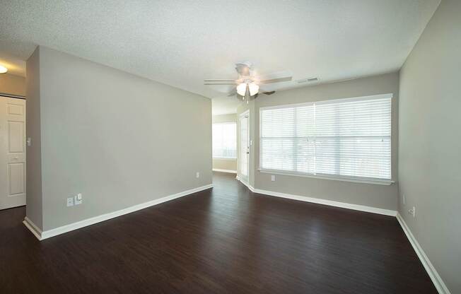Open concept living areas with hardwood-inspired flooring (Signature)