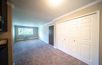 Dining area overlooking living room with closet doors