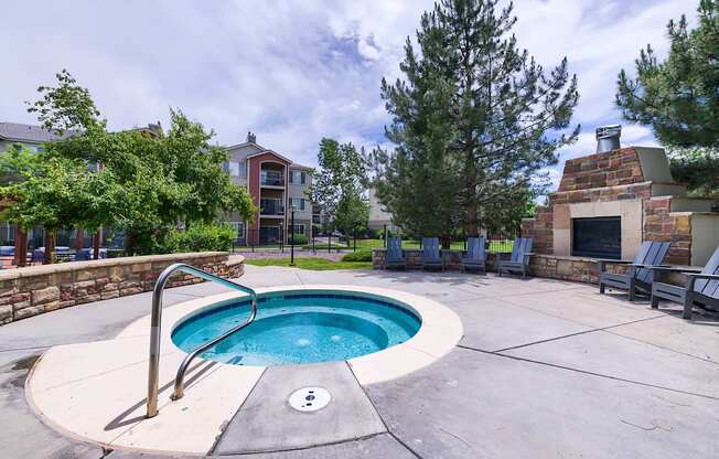 A round swimming pool with a ladder in the middle of it.