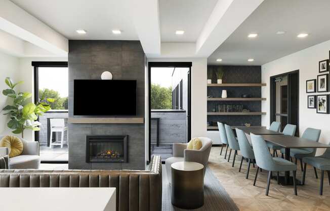 a living room with a fireplace and a table and chairs