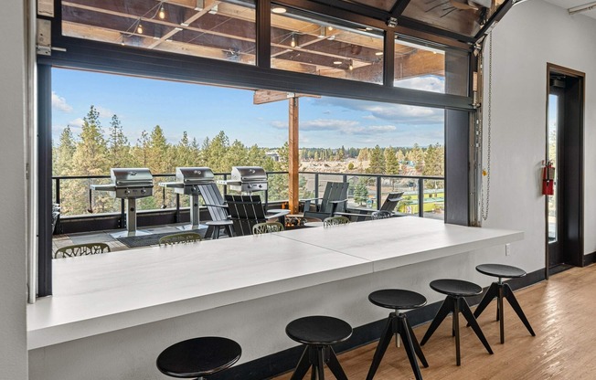 open window displaying bar area in the resident lounge at the hixon
