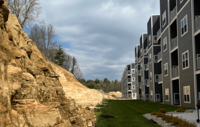 a row of apartment buildings on a hillside