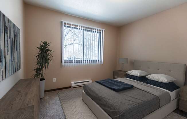 Grand Forks, ND Library Lane Apartments. a bedroom with a bed and a window