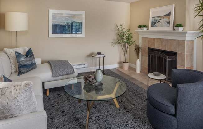 a living room with a fireplace and couches