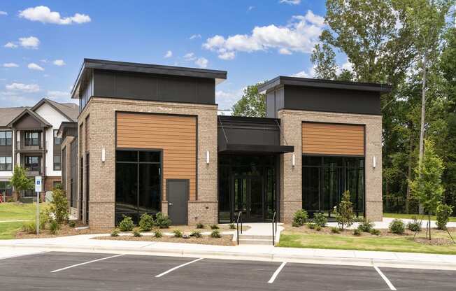 an image of the front of a building with a parking lot