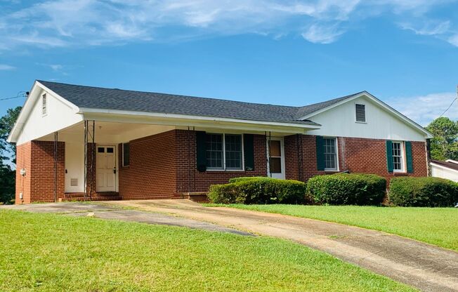 Welcome home! 3 bed, 1.5 bath, newly renovated, brick exterior, carport, hardwood flooring, private lot, must see!