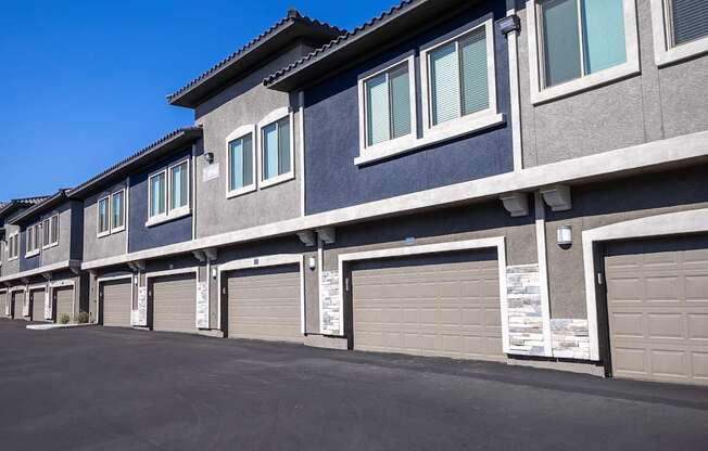 Townhouse buildings with attached 2-car garages.
