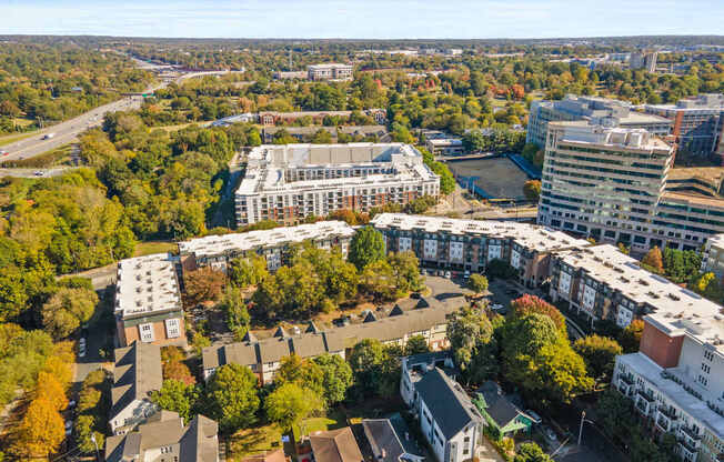 Flatiron West Trade Apartments aerial view with Charlotte skyline in background