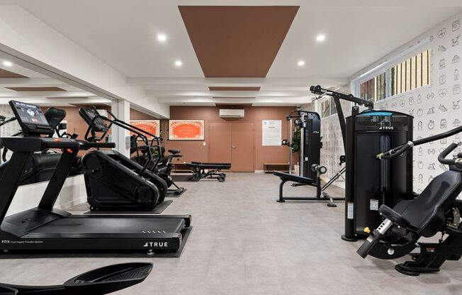 A gym with treadmills and exercise equipment.