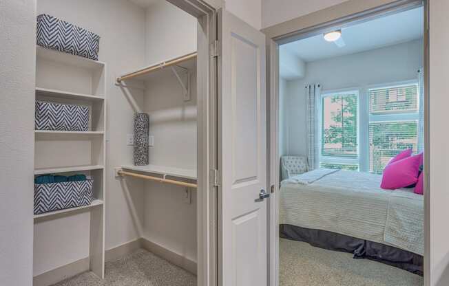 Walk-in closets with custom shelving at Metro West, Plano, TX