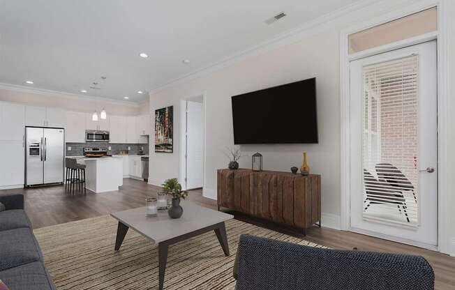 A modern living room with a grey sofa and a wooden coffee table.