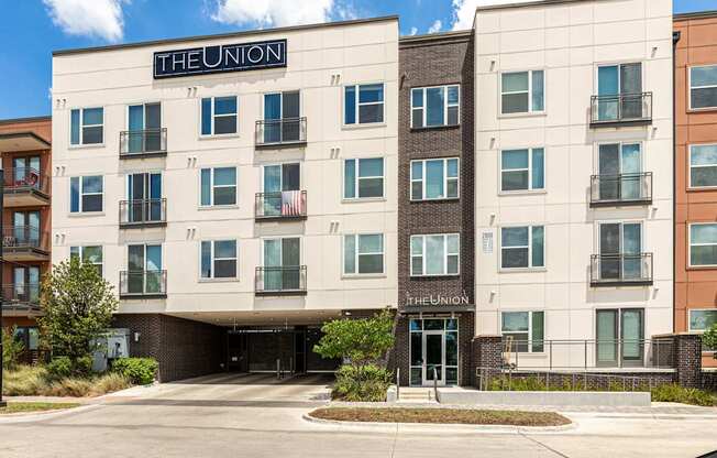 The Union apartment building with a parking lot in front.