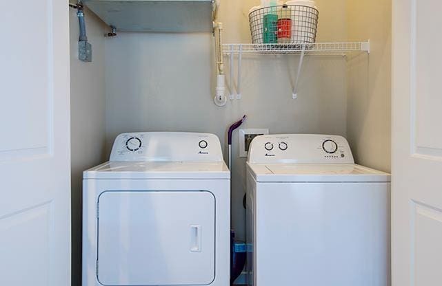 a washer and dryer in a small laundry room