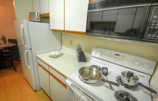 a kitchen with a stove and a refrigerator