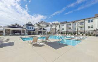 our apartments have a pool and lounge areas with chairs