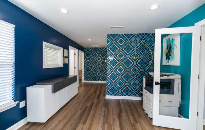 a living room with blue walls and a white door