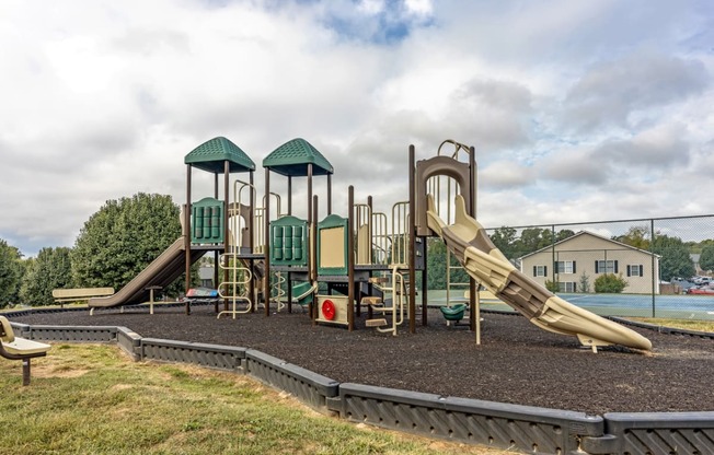 a playground with a slide and climbing equipment