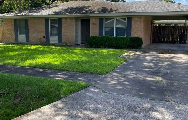 3 Bedroom , 1.5 Bathroom Brick home with carport and fenced yard, with shed,